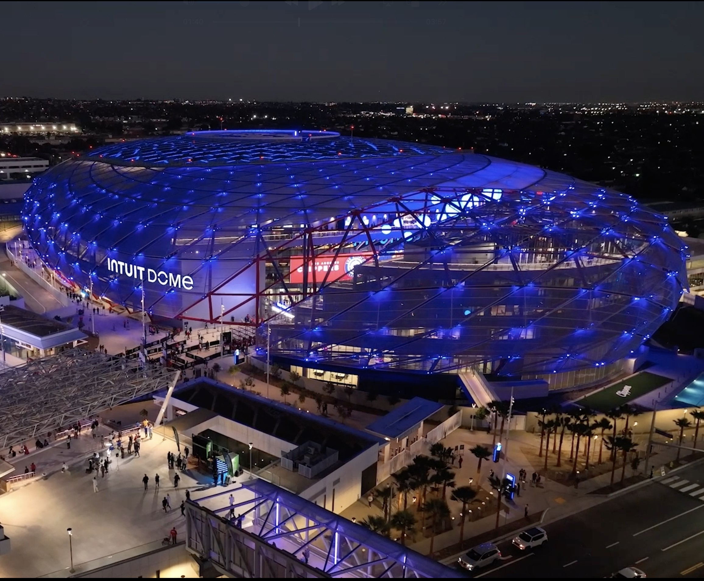 Intuit Dome illuminated at night in Inglewood